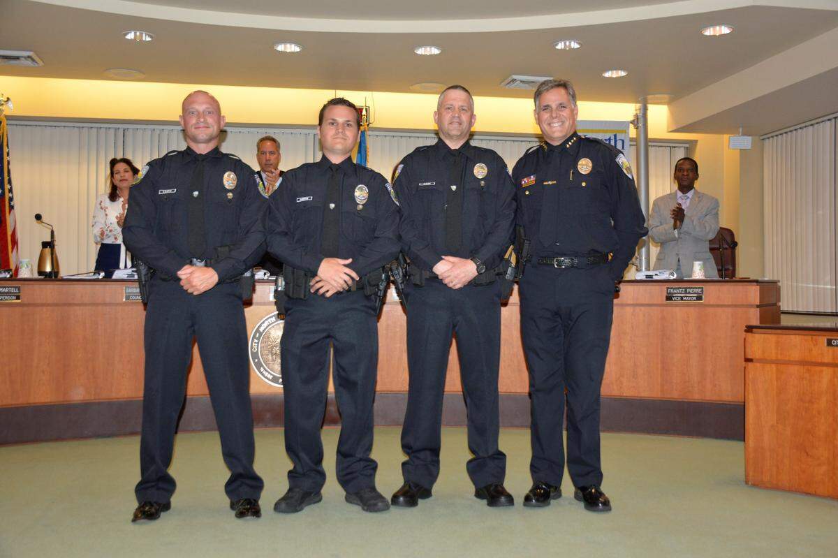 A photograph posted on social media by the North Miami Beach police department on June 8, 2016, shows Nicholes Lentz (far left) being sworn in as an officer.