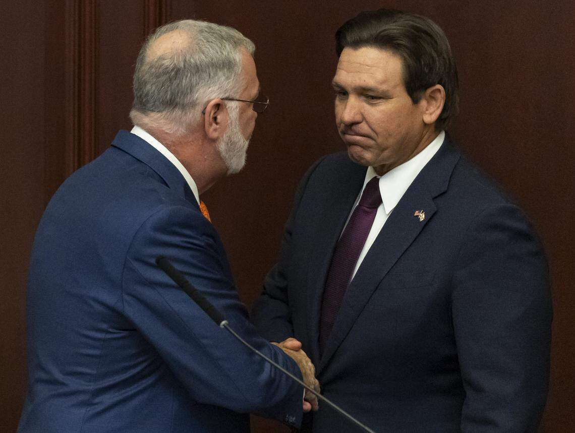 Florida Governor Ron DeSantis shakes hands with Florida Senate President Ben Albritton, R-Wauchula, before delivering his State of the State during the first day of the legislative session at the Florida State Capitol on Tuesday, Jan. 13, 2026, in Tallahassee, Fla.
