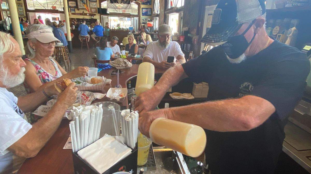 Lou Gammell tends bar at Sloppy Joe’s on its reopening day, Sept. 17, 2020. The bar shut down temporarily due to COVID-19.