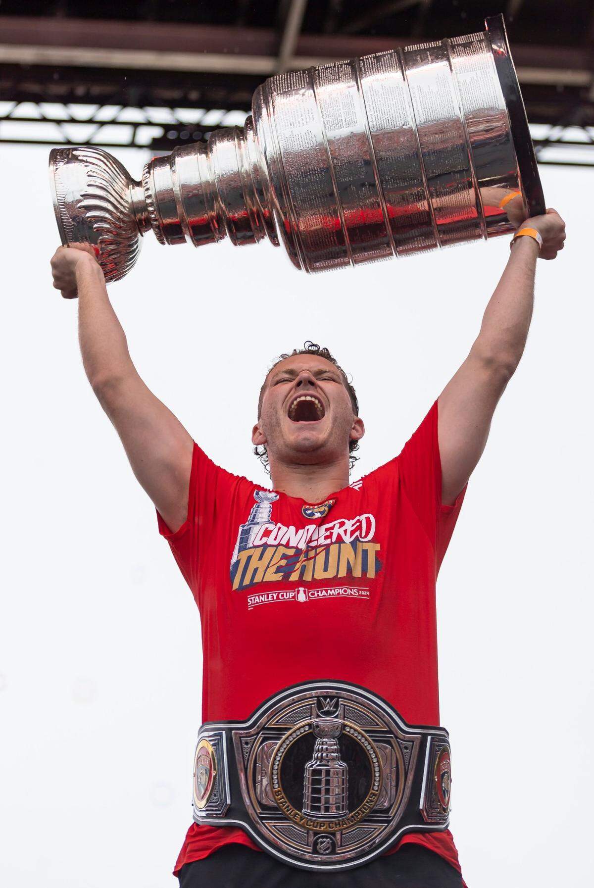 Florida Panthers left wing Matthew Tkachuk (19) lifts the Stanley Cup during a victory parade rally at the Fort Lauderdale Beach Park off A1A on Sunday, June 30, 2024, in Fort Lauderdale, Fla. The parade was held to celebrate the Florida Panthers after they defeated the Edmonton Oilers in Game 7 of the Stanley Cup Final.