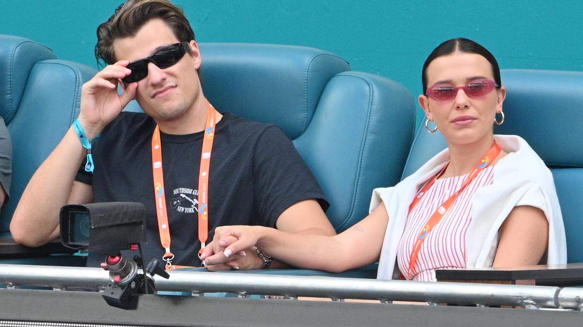 MIAMI GARDENS, FLORIDA - MARCH 27: Jake Bongiovi and Millie Bobby Brown attend the Miami Open on Day 10 at Hard Rock Stadium on March 27, 2025 in Miami Gardens, Florida. Not pictured are Jon Bon Jovi and Dorothea Hurley.