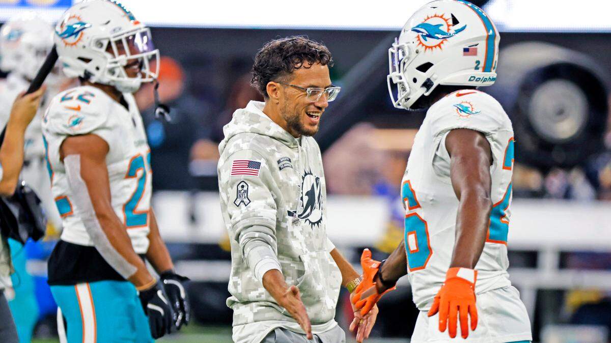 Miami Dolphins coach Mike McDaniel greets safety Marcus Maye (26) before the game against the Los Angeles Rams for their NFL football game at SoFi Stadium in Inglewood, California on Monday, November 11, 2024.