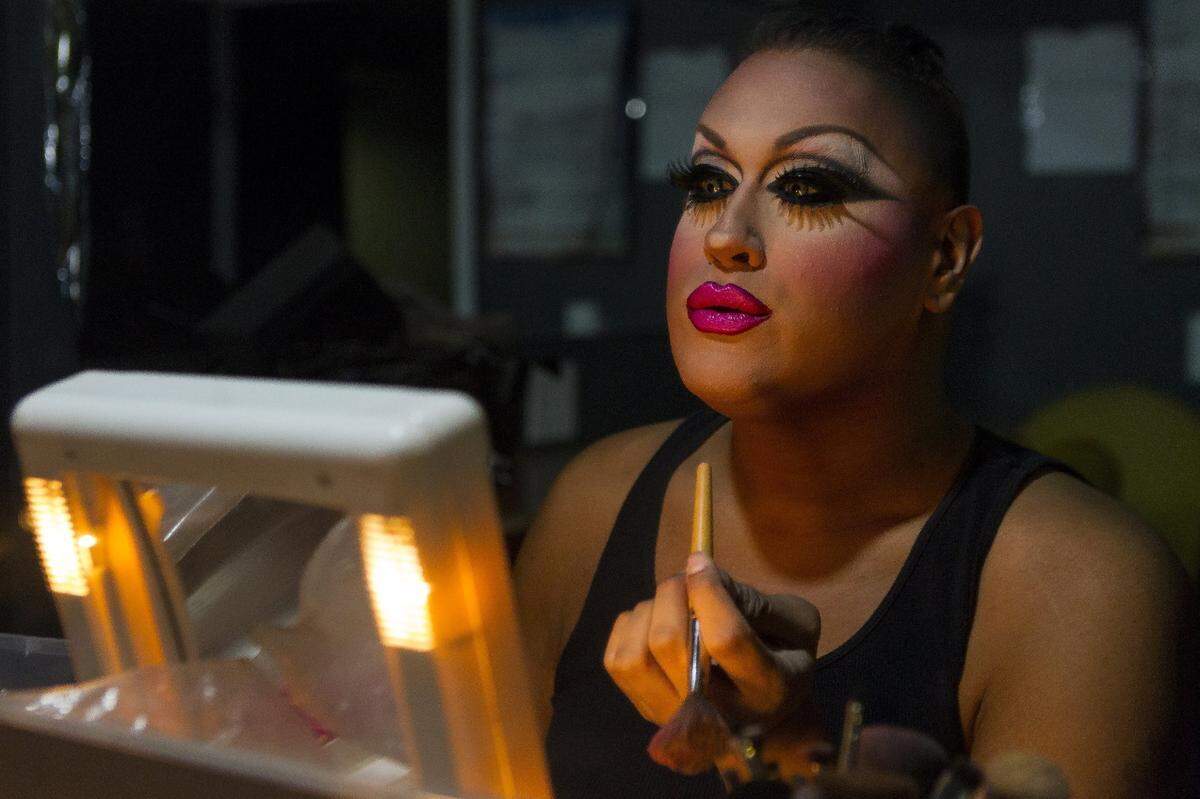 Noel Leon, 37, puts on lip liner in a dressing room at the Palace Bar in Miami Beach on Jan. 31, 2018. Leon is an entertainer at the Palace.