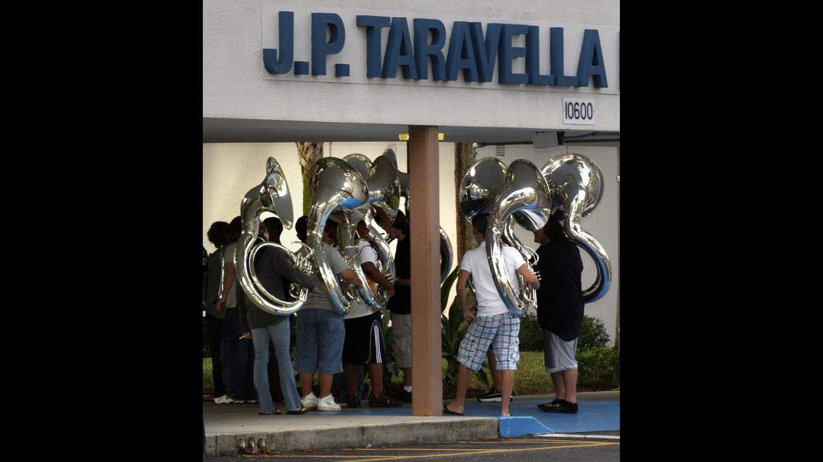 The tuba section of the J.P. Taravella Marching Trojans stood outside the Coral Springs school entrance in this February 2008 file photo. The band that year was selected to play in the inaugural parade of President-elect Barack Obama. The school is at 10600 Riverside Dr., Coral Springs.