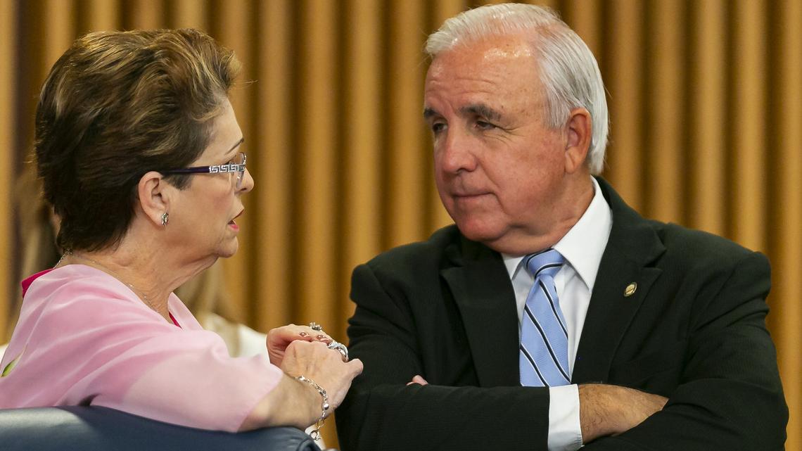Miami-Dade County Mayor Carlos Gimenez, right, talks to Commissioner Rebeca Sosa at Wednesday’s meeting where commissioners adopted the mayor’s recommendation to solicit bids for a Miami-to-Miami-Beach transit link. Sosa voted against it.