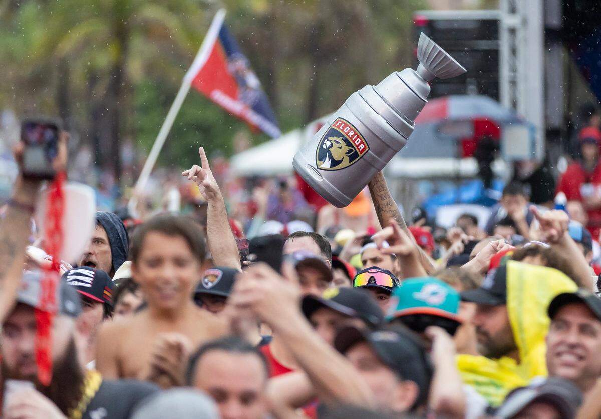 Florida Panthers fans cheer as their team make their way toward the stage during a victory parade at the Fort Lauderdale Beach Park off A1A on Sunday, June 30, 2024, in Fort Lauderdale, Fla. The parade was held to celebrate the Florida Panthers after they defeated the Edmonton Oilers in Game 7 of the Stanley Cup Final.