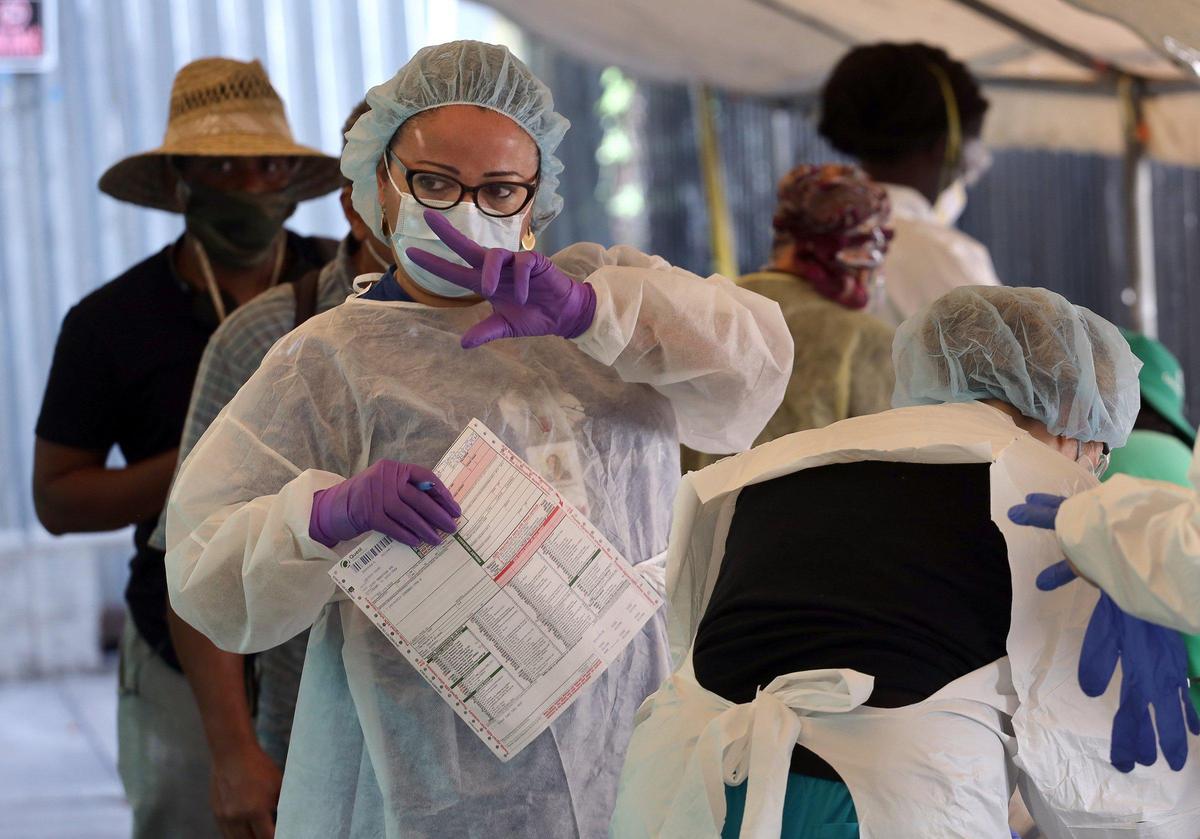 Camillus Health Concern nurses and practitioners conduct COVID-19 testing at the Missionaries of Charity of Mother Teresa, a homeless shelter operated by the Archdiocese of Miami on Wednesday, May 6, 2020.