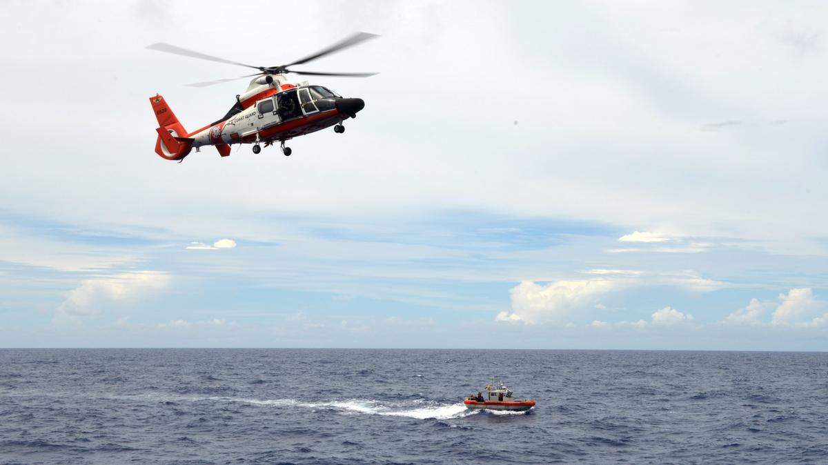The Coast Guard responded to a downed plane 23 miles east of Palm Beach, officials said Friday.