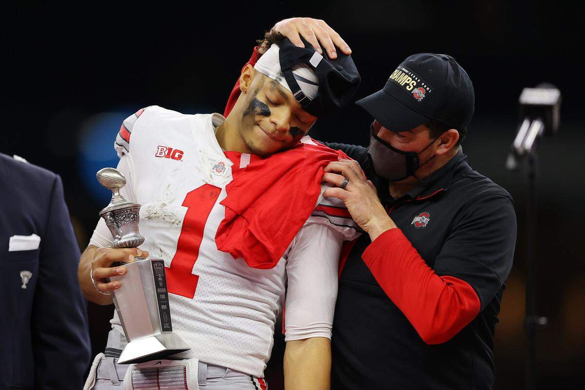Justin Fields #1 and head coach Ryan Day of the Ohio State Buckeyes react after defeating the Clemson Tigers 49-28 during the College Football Playoff semifinal game at the Allstate Sugar Bowl at Mercedes-Benz Superdome on January 01, 2021 in New Orleans, Louisiana.
