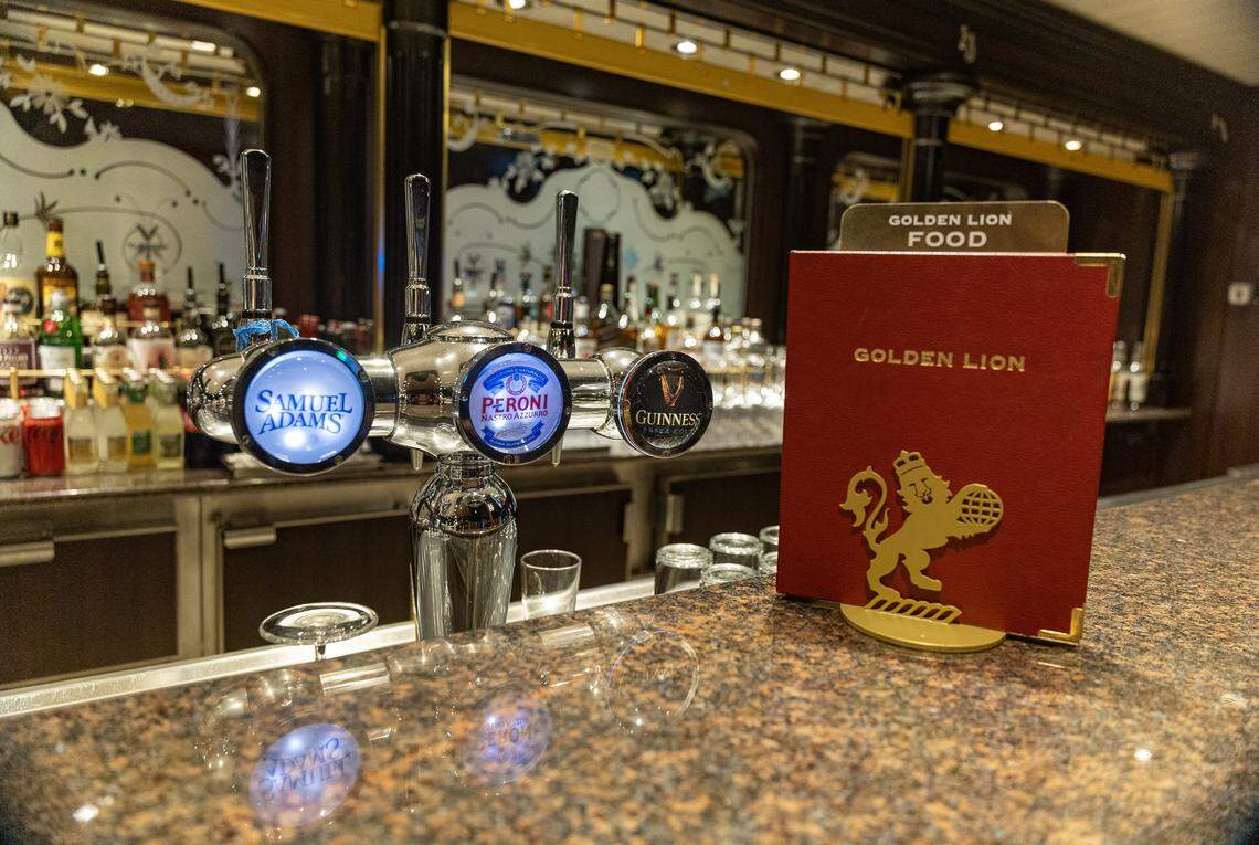 View of the Golden Lion Pub's bar on deck two of the Cunard cruise ship Queen Elizabeth', as it sits docked at PortMiami on Thursday, Oct. 16, 2025, in Miami. The vessel arrived around 6 a.m. and will be based in Miami for six months, offering voyages to the Caribbean. After tours and festivities, the ship is scheduled to depart later Thursday on its inaugural 12-night Caribbean cruise.