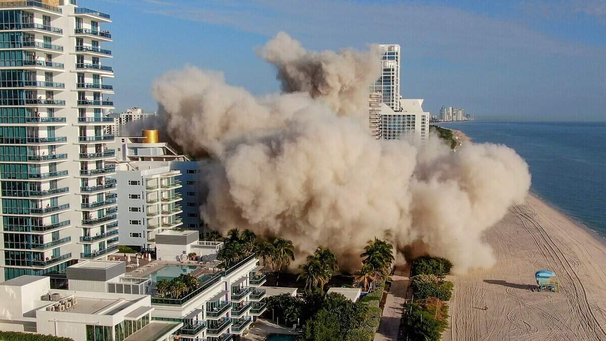 The 17-story hotel tower of the historic Deauville Beach Resort in Miami Beach is razed in November 2022.