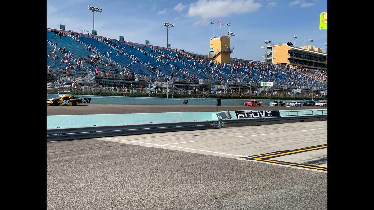 Polesitter Taylor Gray (54) leads eventual winner Justin Allgaier (7), Sam Mayer (41) and Connor Zilisch (88) into Turn 1 at Homestead-Miami Speedway early in the Hard Rock Bet 300 Xfinity Series race, March 22, 2025.