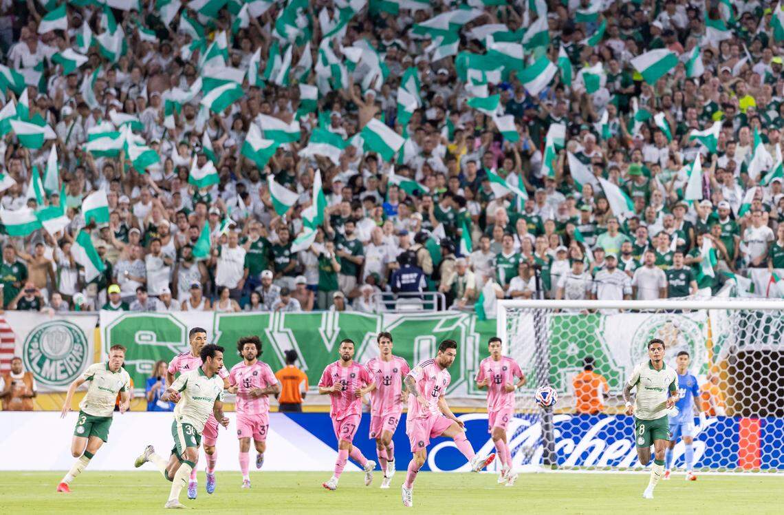 Inter Miami forward Lionel Messi (10) passes the ball as Palmeiras midfielder Lucas Evangelista (30) defends in the second half of their Group A third-round FIFA Club World Cup soccer match at Hard Rock Stadium on Monday, June 23, 2025, in Miami Gardens, Fla.