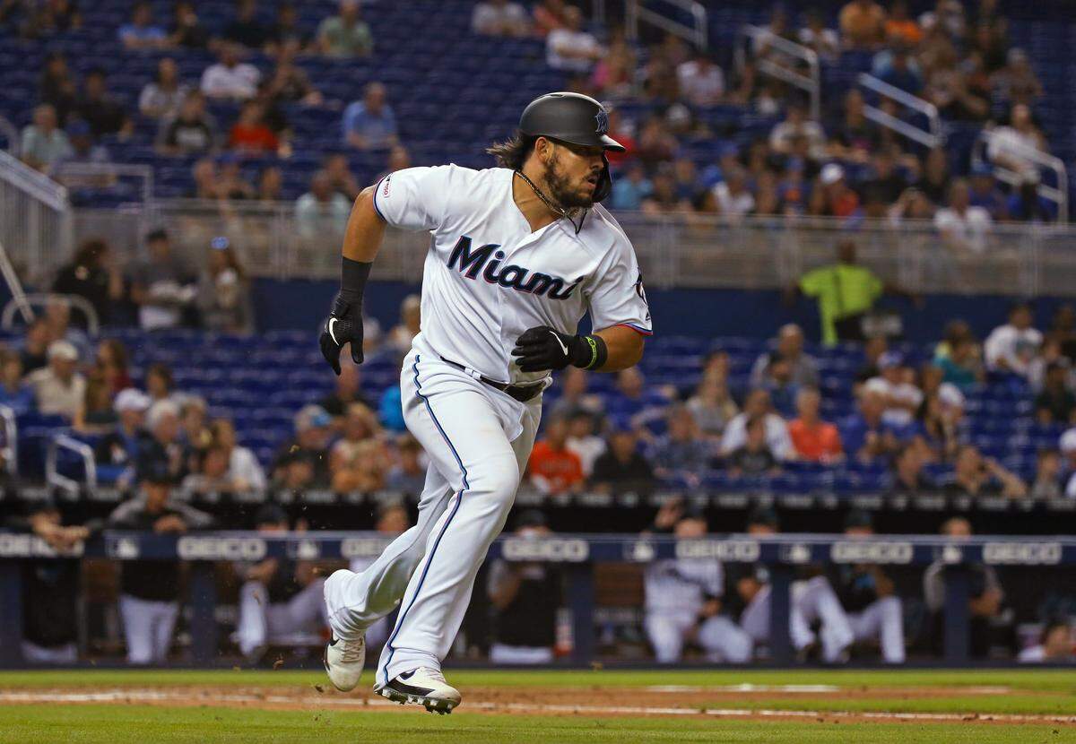 Miami Marlins catcher Jorge Alfaro (38) runs to first base after hitting a single during the fourth inning of Major League Baseball game at Marlins Park in Miami, Tuesday, April 16, 2019.