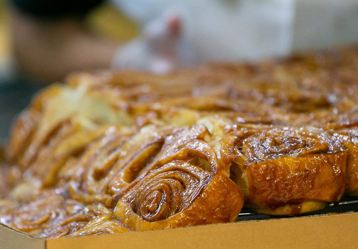 Cinnamon rolls are prepared at Knaus Berry Farm during their opening day in Homestead, Florida, on Tuesday, Oct. 26, 2021.