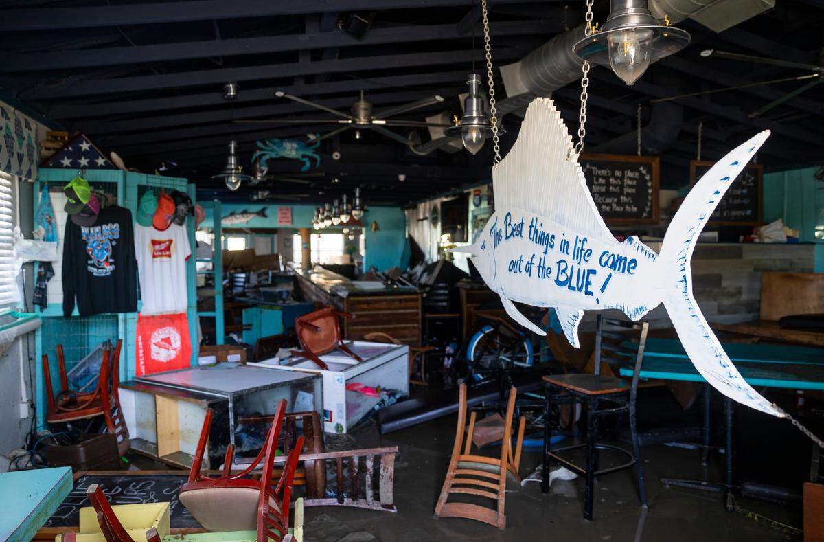An inside view of the Blue Dog Bar & Grill restaurant on Thursday, Sept. 29, 2022, in Matlacha, Fla. Hurricane Ian made landfall on the coast of South West Florida as a category 4 storm Tuesday afternoon leaving areas affected with flooded streets, downed trees and scattered debris.