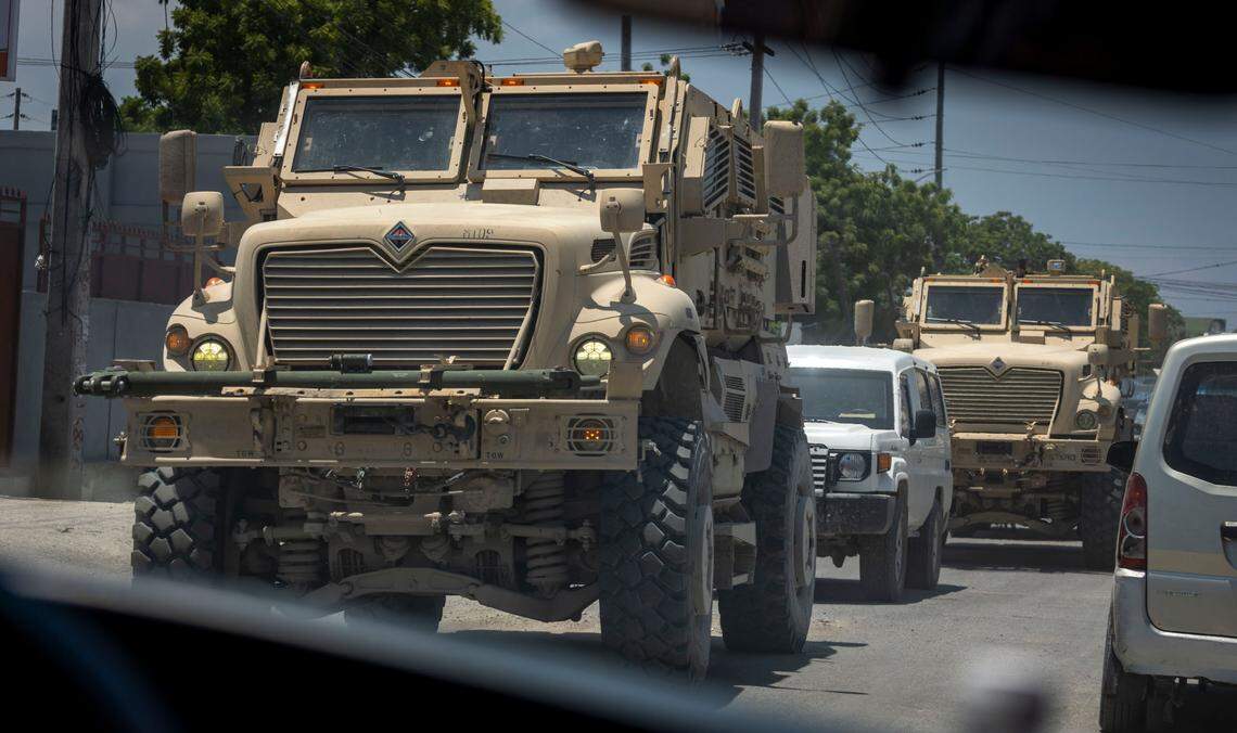 Armored vehicles used by Kenyan police rumble through the streets of Port-au-Prince, Haiti. The vehicles are part of the United States’ more than $600 million in contributions to the U.N.-backed Multinational Security Support mission.