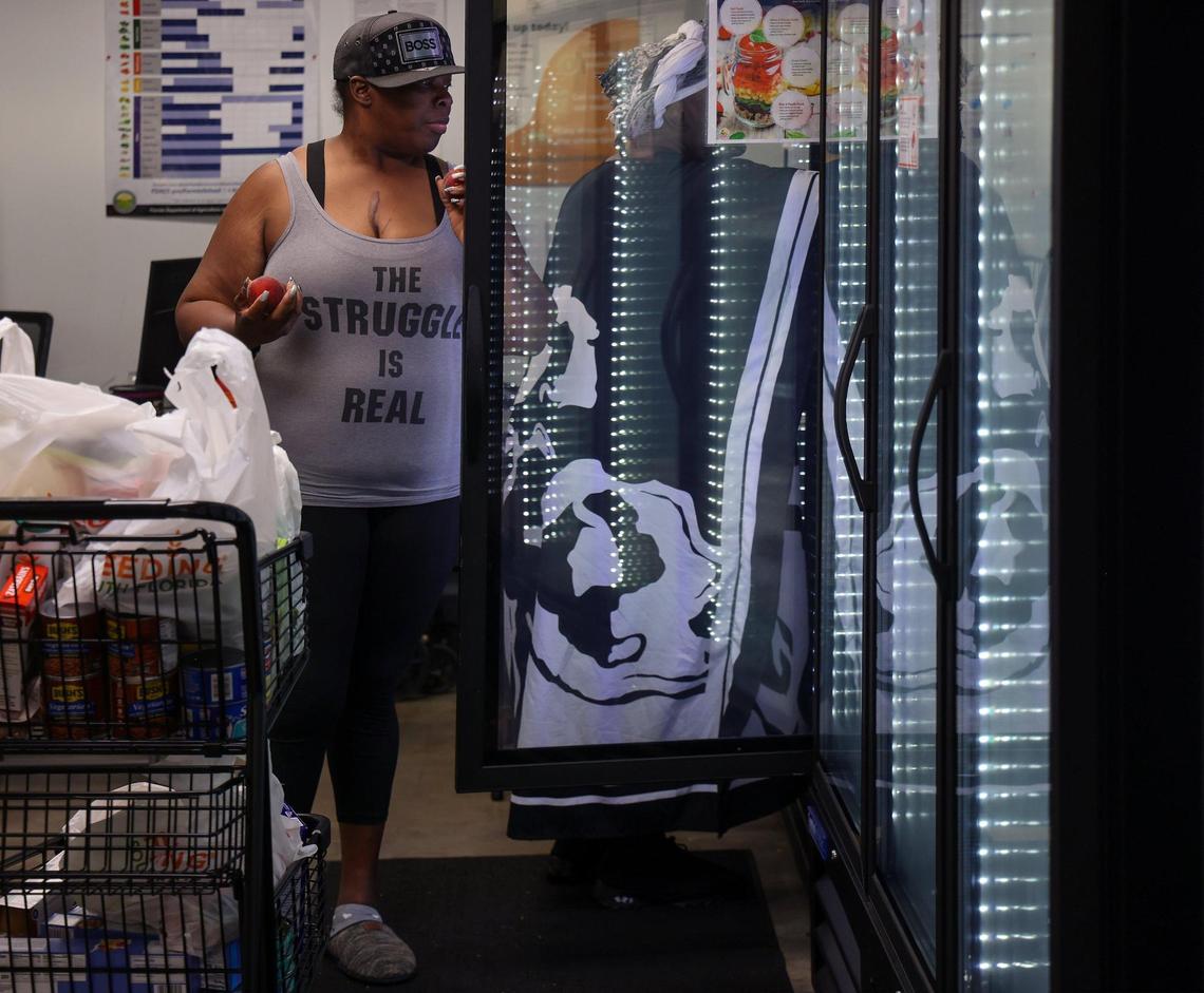 Lathoya Bennett, 49, left, and Jackie Brown, 57, right, shop for fresh produce at Feeding South Florida’s Pembroke Park food bank on Wednesday, May 28, 2025.