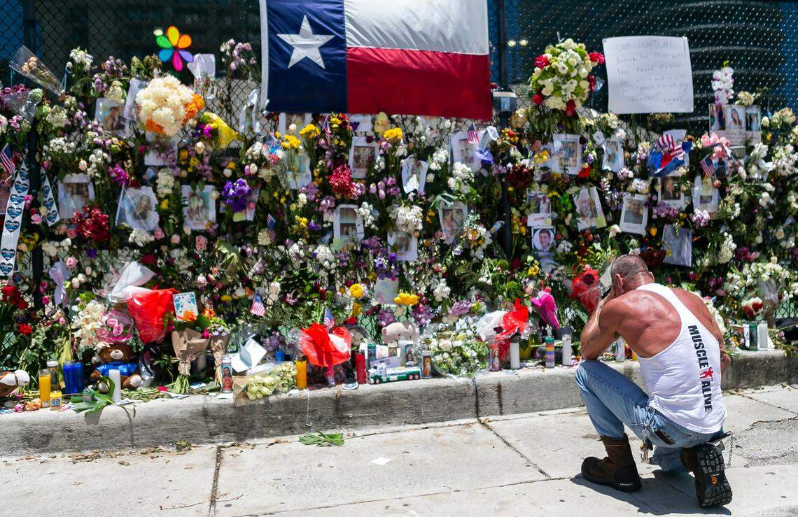 Mourners visited a makeshift memorial near the site of the collapsed Champlain Towers South condo in Surfside, Florida, on Saturday, July 3, 2021.
