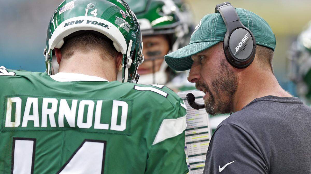 New York Jets coach Adam Gase, formerly of the Dolphins, confers with quarterback Sam Darnold during game in Miami last year. Gase’s 0-3 Jets attempt to win their first game of 2020 Thursday night.