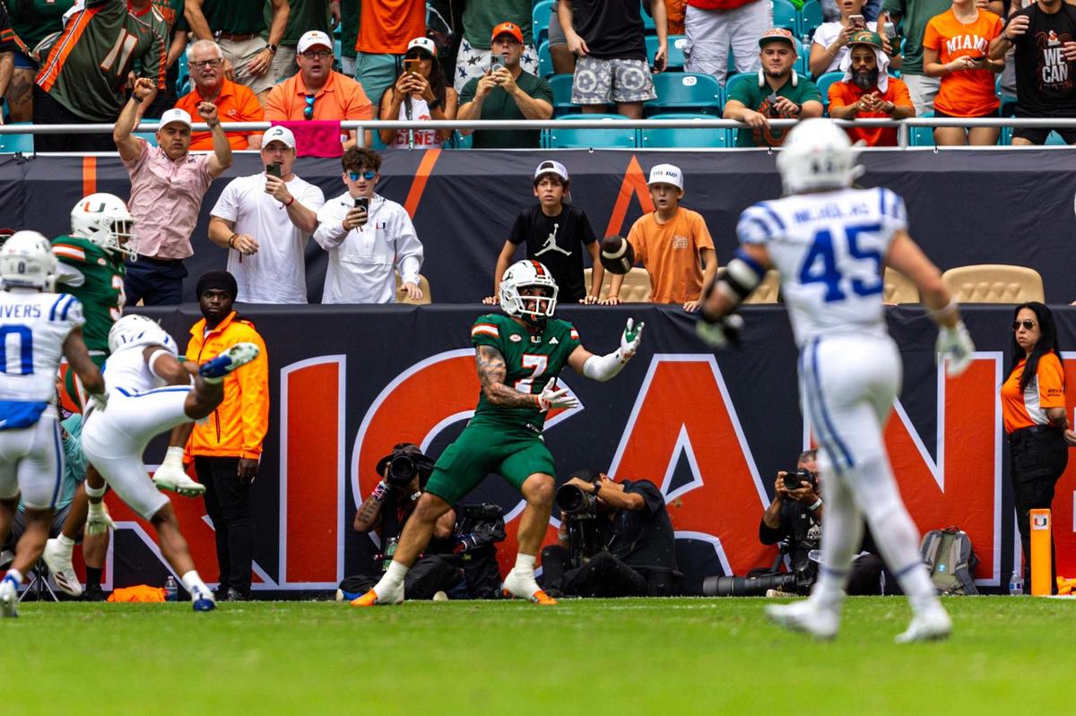 Miami Hurricanes wide receiver Xavier Restrepo (7) catches the tipped pass for a touchdown during the first half of an ACC football game against the Duke Blue Devils at Hard Rock Stadium on Saturday, Nov. 2, 2024, in Miami Gardens, Fla.