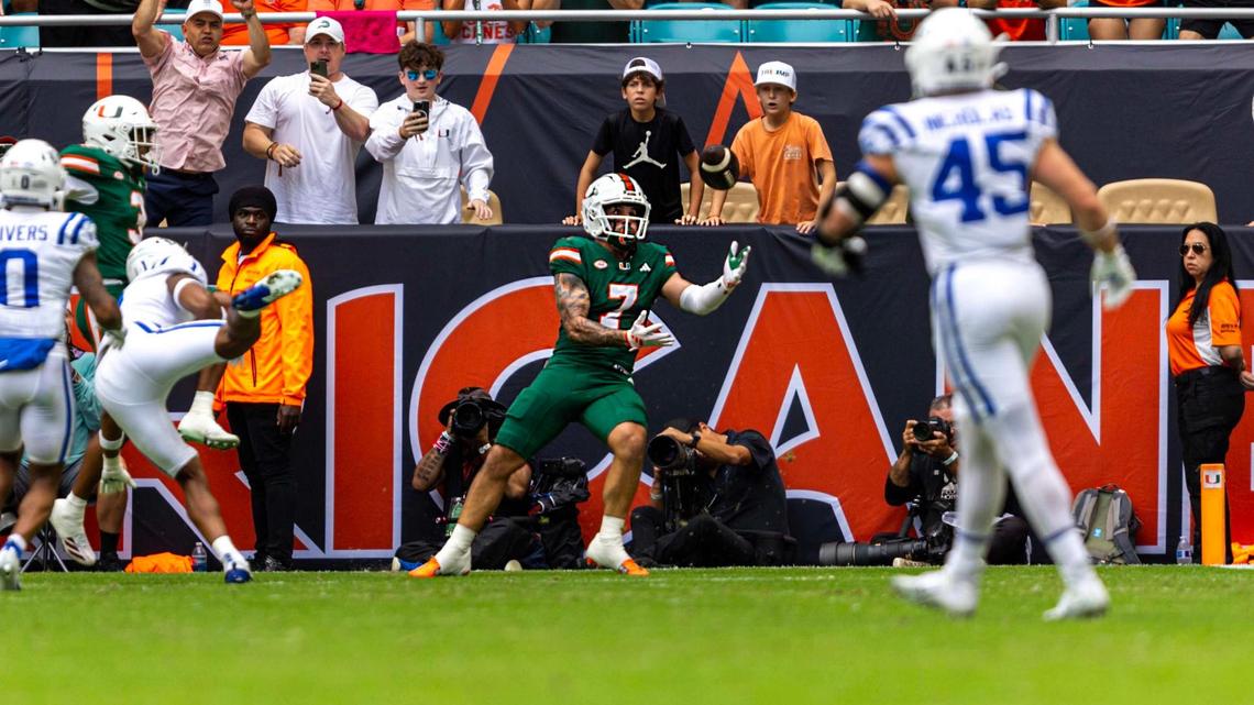Miami Hurricanes wide receiver Xavier Restrepo (7) catches the tipped pass for a touchdown during the first half of an ACC football game against the Duke Blue Devils at Hard Rock Stadium on Saturday, Nov. 2, 2024, in Miami Gardens, Fla.