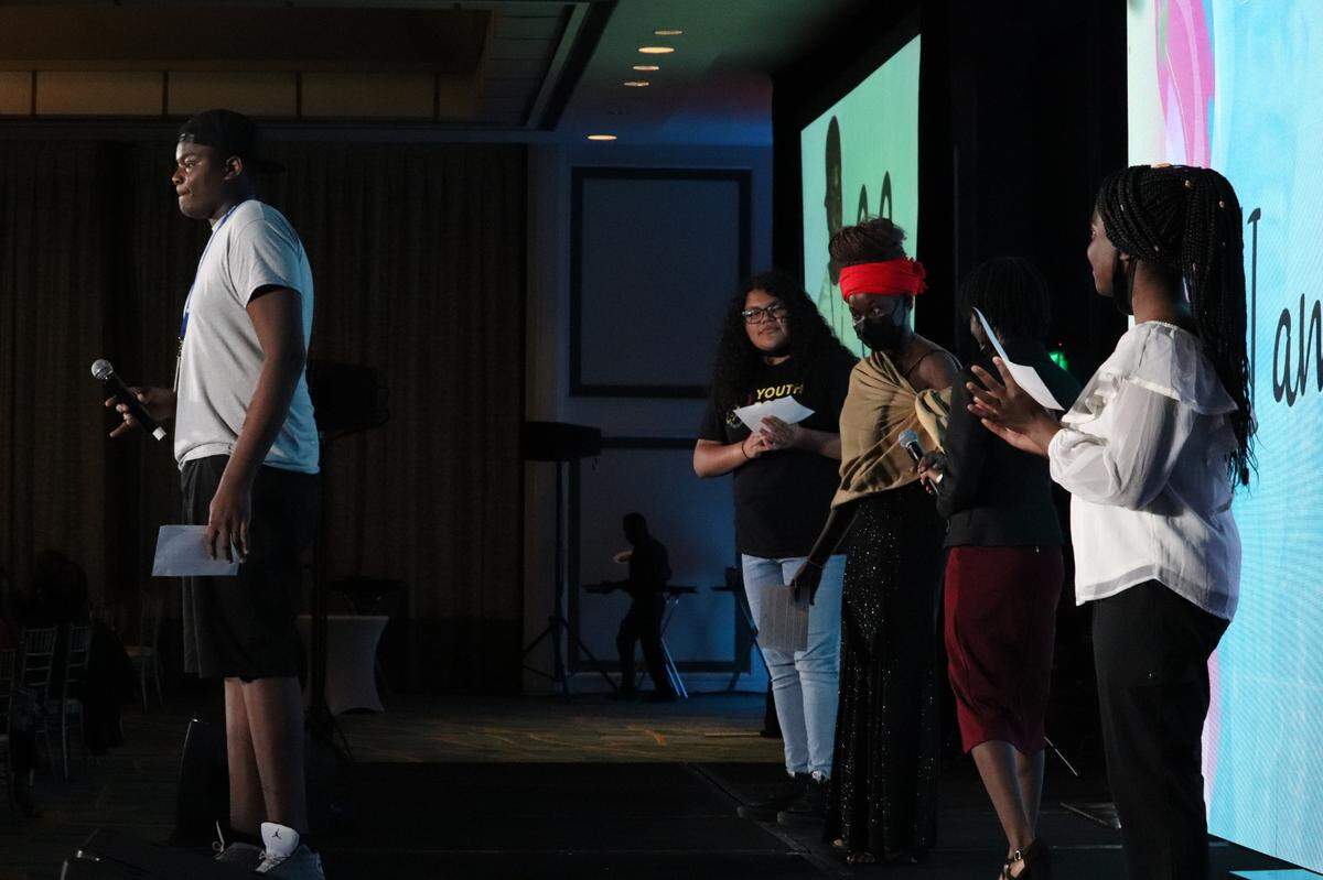 Antonio Brooks, a seventh grader, explains why he enjoys being part of City Life KIX at Youth for Christ Miami’s annual “Be The Story” banquet at the Hilton Miami Airport Blue Lagoon on Saturday, April 2, 2022.