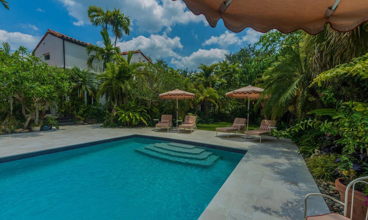 Ready for a swim? Alain Carrazana, a landscape designer and co-owner of the historic residence, designed a lush tropical landscape surrounding the pool.