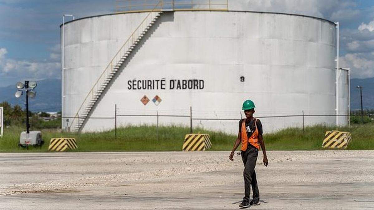 A worker walks at Terminal Varreux in Port-au-Prince, Haiti, on November 8, 2022. (Photo by Richard Pierrin / AFP) (Photo by RICHARD PIERRIN/AFP via Getty Images)