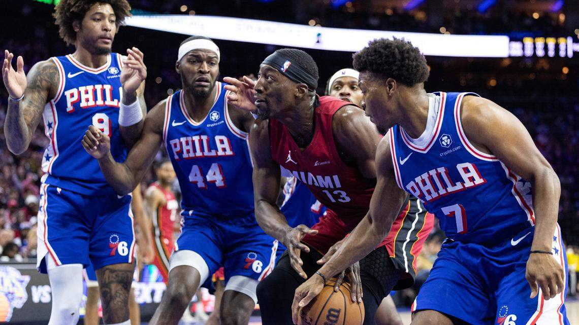 Philadelphia 76ers guard Kyle Lowry (7) takes the ball away from Miami Heat center Bam Adebayo (13) during the third quarter at Wells Fargo Center.
