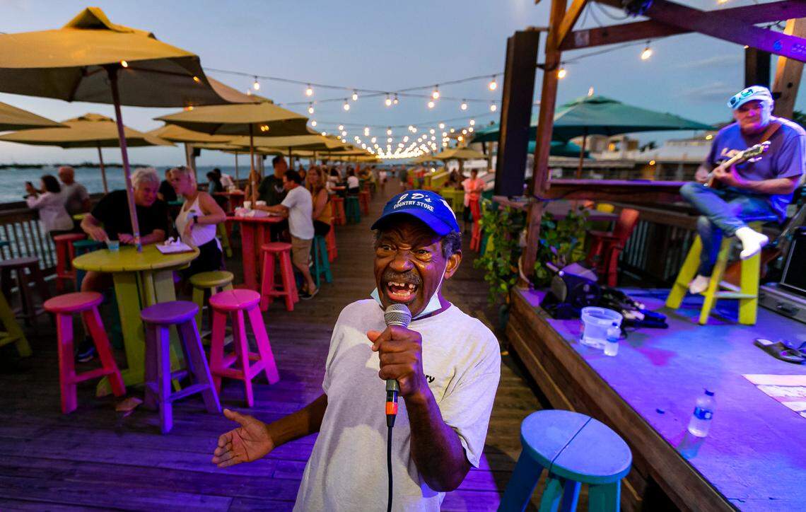 Robert Albury performs with his band at Sunset Pier in Key West, Florida, on Sunday, Dec. 12, 2021.