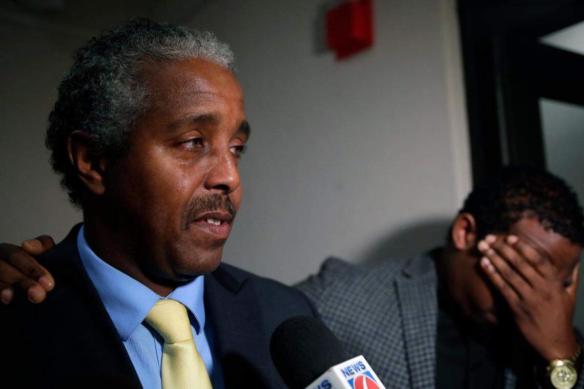 Thomas Greenlee, son of Charles Greenlee, one of the men in the Groveland Four, sheds a tear after his father was pardoned by Gov. Ron DeSantis and his cabinet during a clemency board hearing at the Florida State Capitol on Jan. 11. Thomas Greenlee’s son Brian Greenlee, right, also shed tears during the interview.