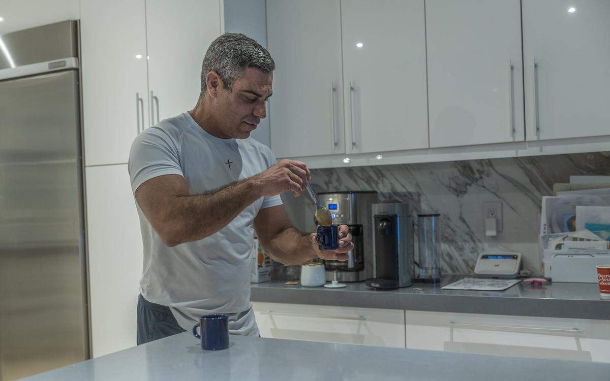 Francis Suarez prepares some coffee before starting his morning workout at home in Miami on Tuesday, Sept. 29, 2025.