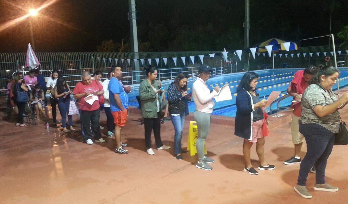 Families lined up overnight to sign up their kids for swim lessons at Shenandoah Pool before registration opened at 6 a.m. on Monday, Oct. 22.