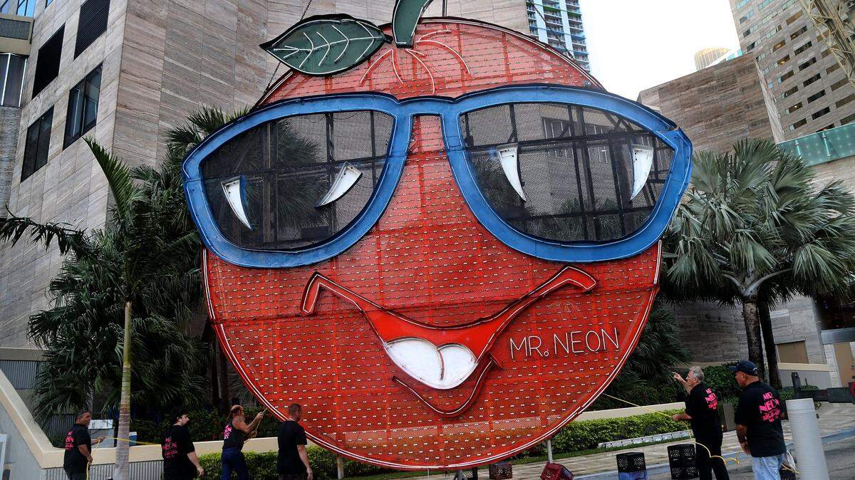 A look at the Big Orange when the neon mascot climbed up a hotel in past years.