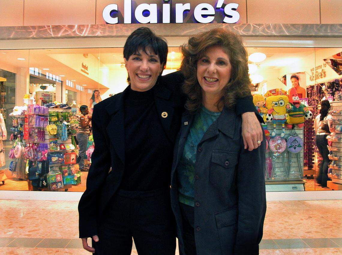 In this file photo from April 17, 2004, Bonnie and Marla Schaefer, daughters of Claire’s founder Rowland Schaefer, are pictured together at the Claire’s store in Pembroke Pines. They took over Claire's Corporation at the time when their father stepped down in 2003.