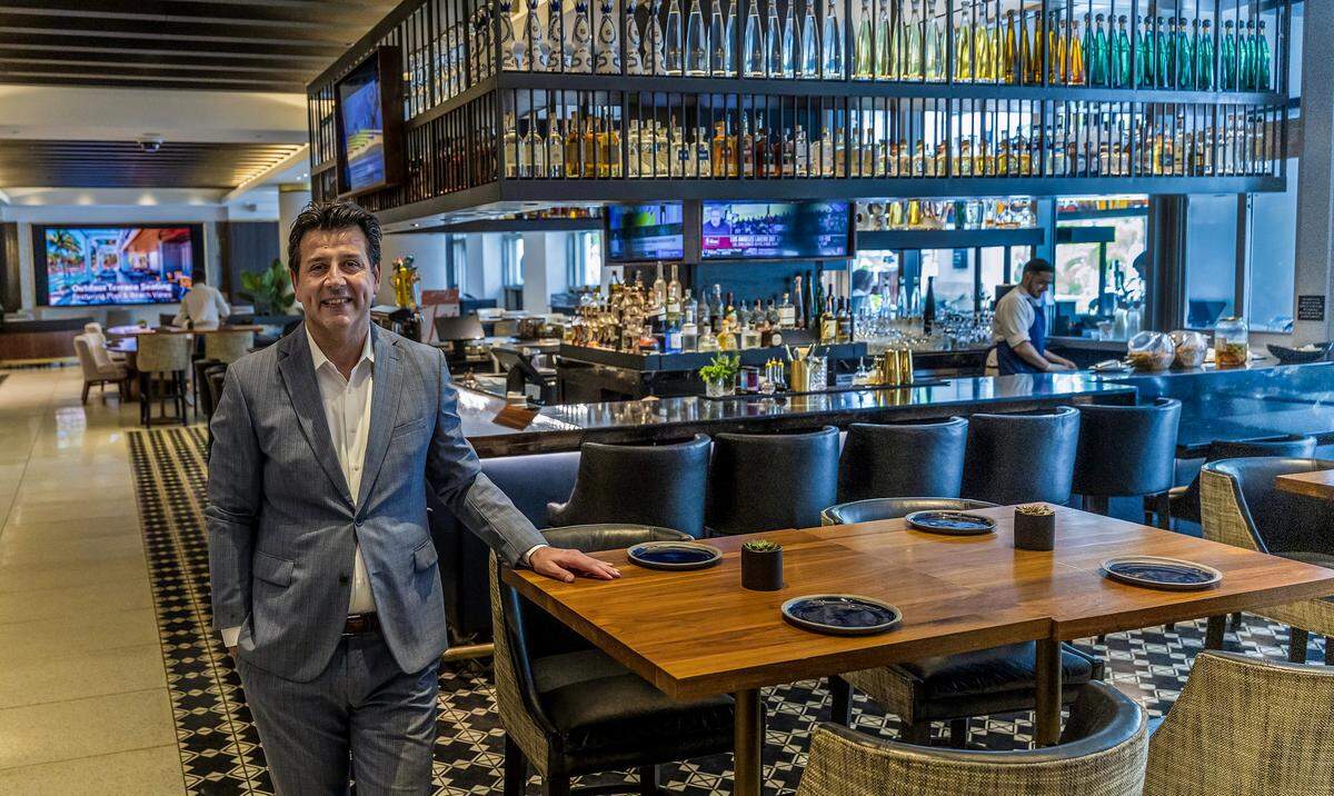 Mutluhan Kucuk, managing director of the Loews Miami Beach Hotel, at the recently remodeled bar at the lobby of the property, 1601 Collins Ave, on Wednesday, Nov. 26, 2025. 
