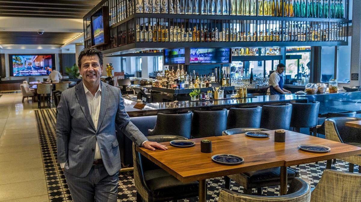 Mutluhan Kucuk, Managing Director of Loews Miami Beach Hotel, poses at the recently remodeled bar at the lobby of the property located at 1601 Collins Ave, on Wednesday, November 26, 2025.