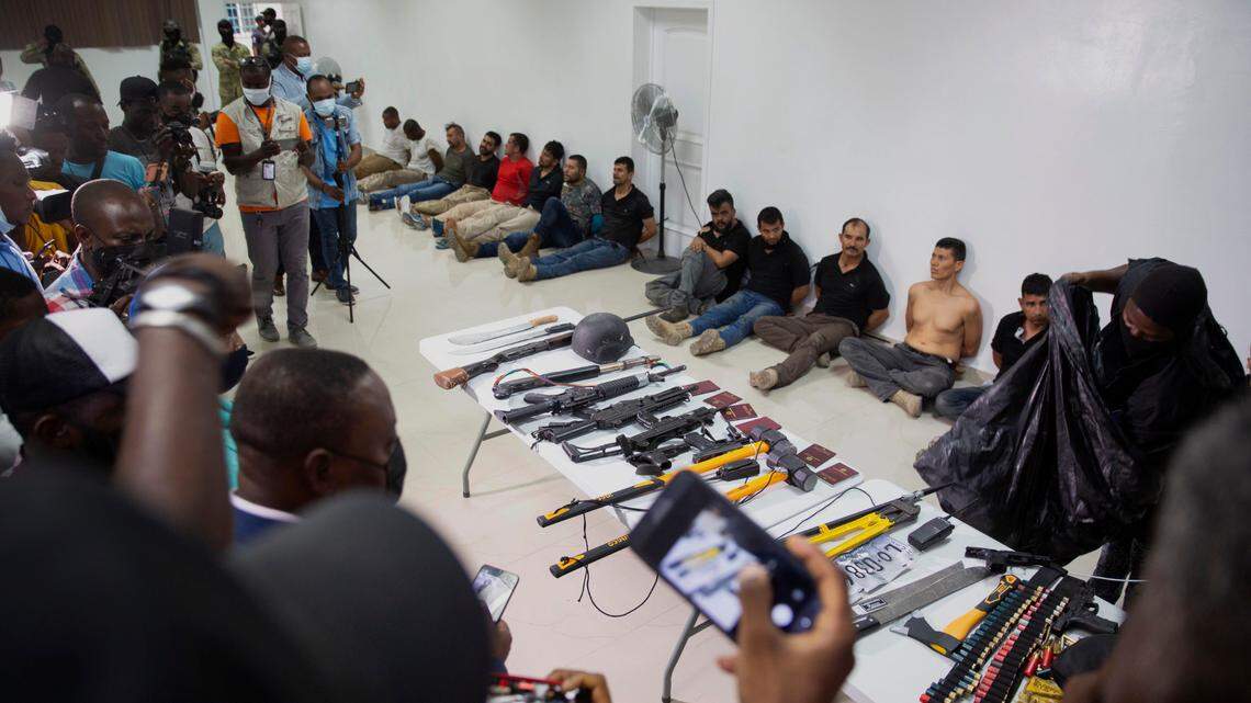 In this July 8, 2021, file photo, suspects in the assassination of Haiti’s President Jovenel Moïse are shown to the media, along with the weapons and equipment they allegedly used in the attack, at police headquarters in Port-au-Prince, Haiti.