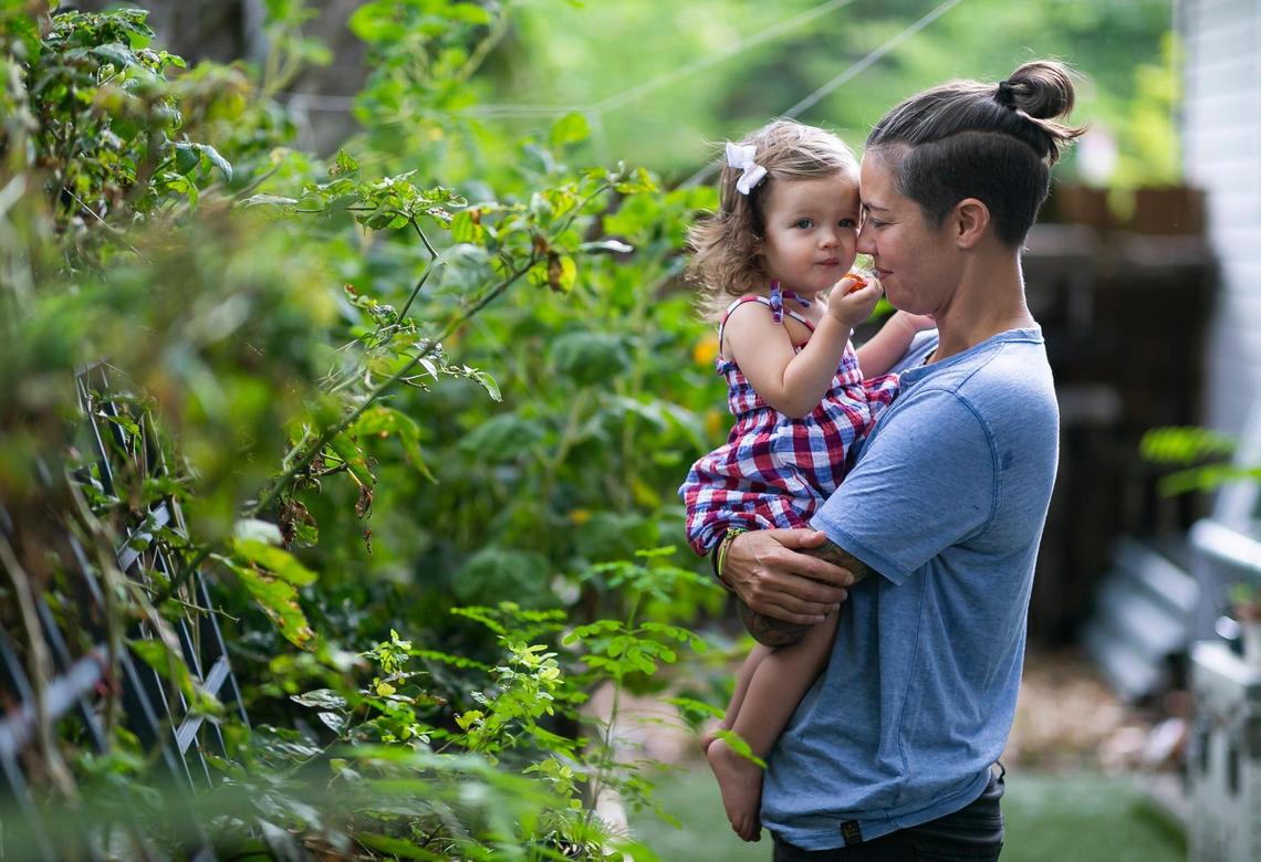 Broward Sheriff’s Office Battalion Chief Nichole Notte, 41, holds her daughter, Luca, 1, at their home on Tuesday, June 21, 2022 in Fort Lauderdale, Fla.