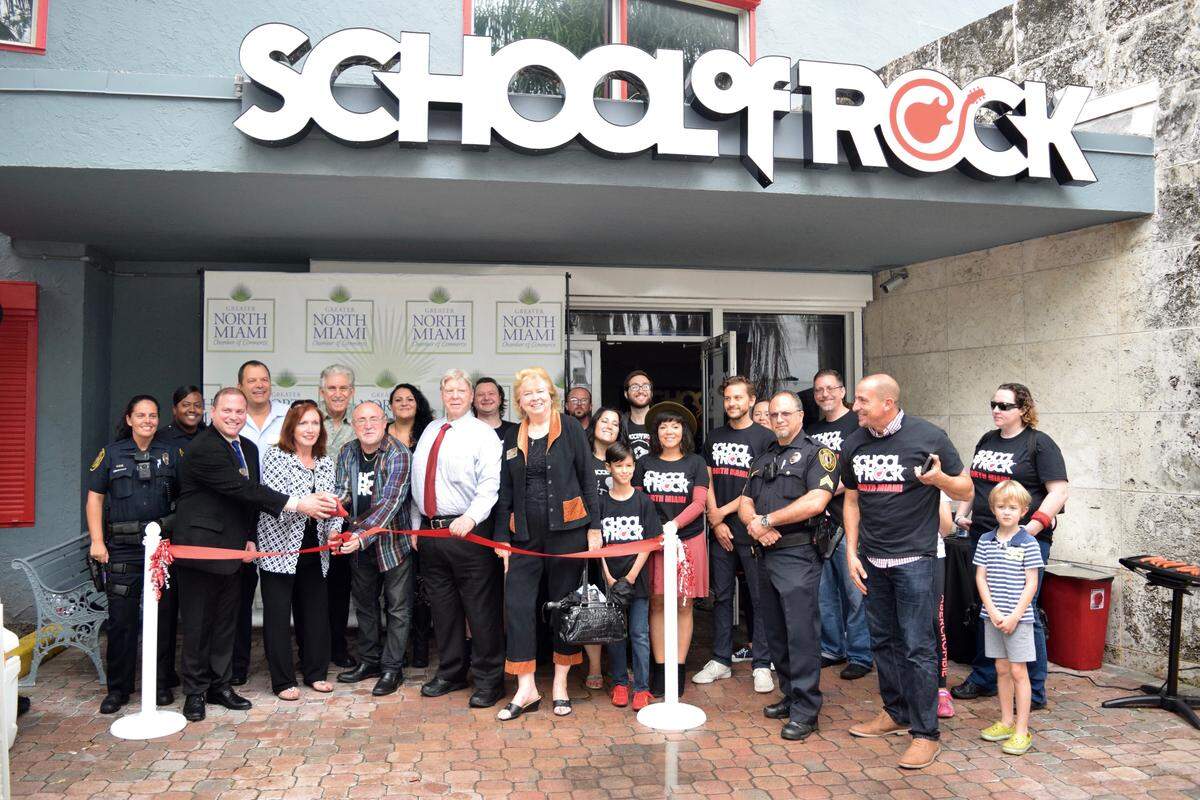 Students, parents and community leaders celebrate the opening Saturday of School of Rock in North Miami.