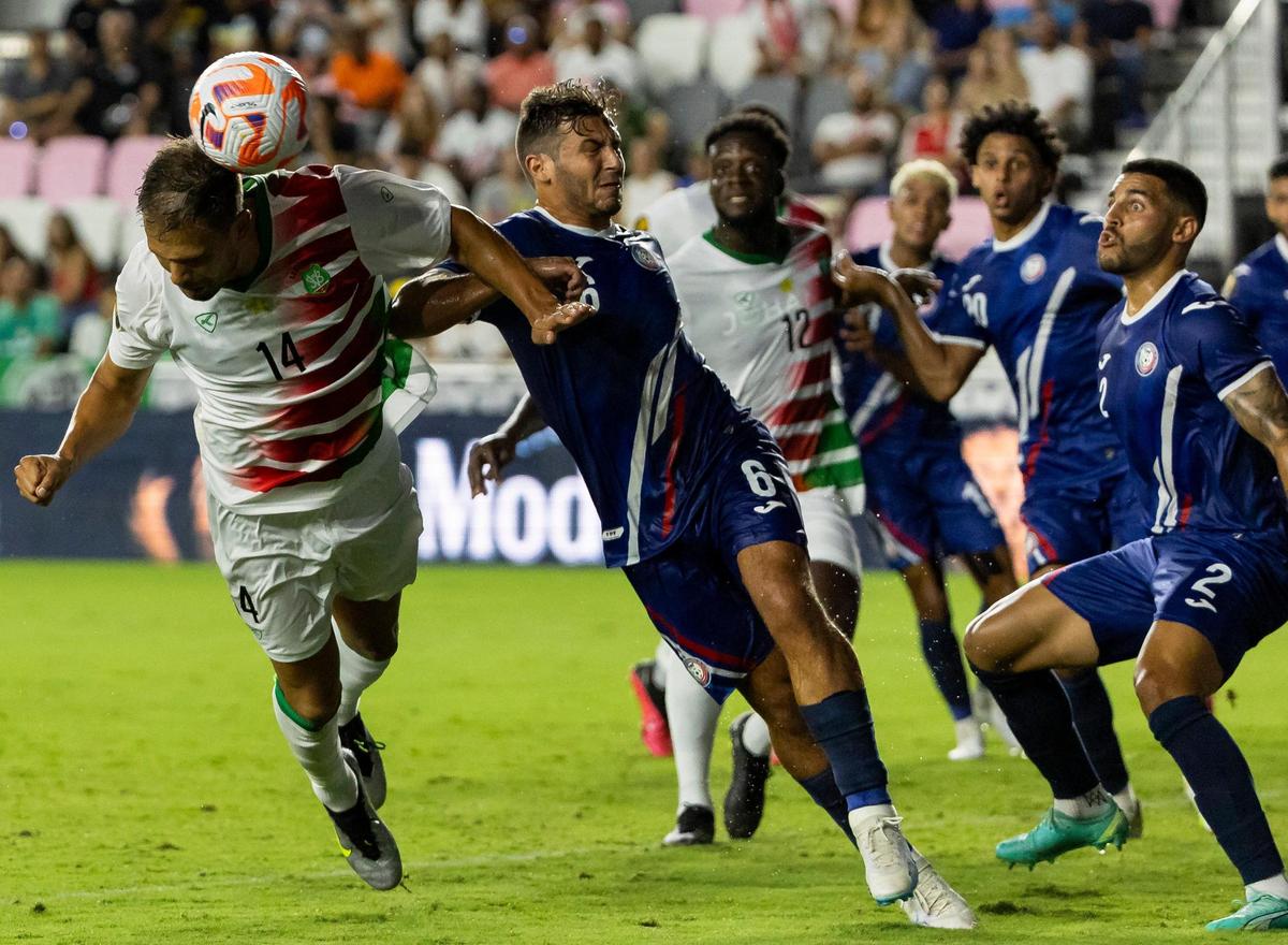 Suriname forward Mitchell Te Vrede (14) tries to score a goal with a header as Puerto Rico midfielder Juan O’Niell (6) defends in the first half of their CONCACAF Gold Cup 2023 preliminary match at DRV PNK Stadium on Saturday, June 17, 2023, in Fort Lauderdale, Fla.