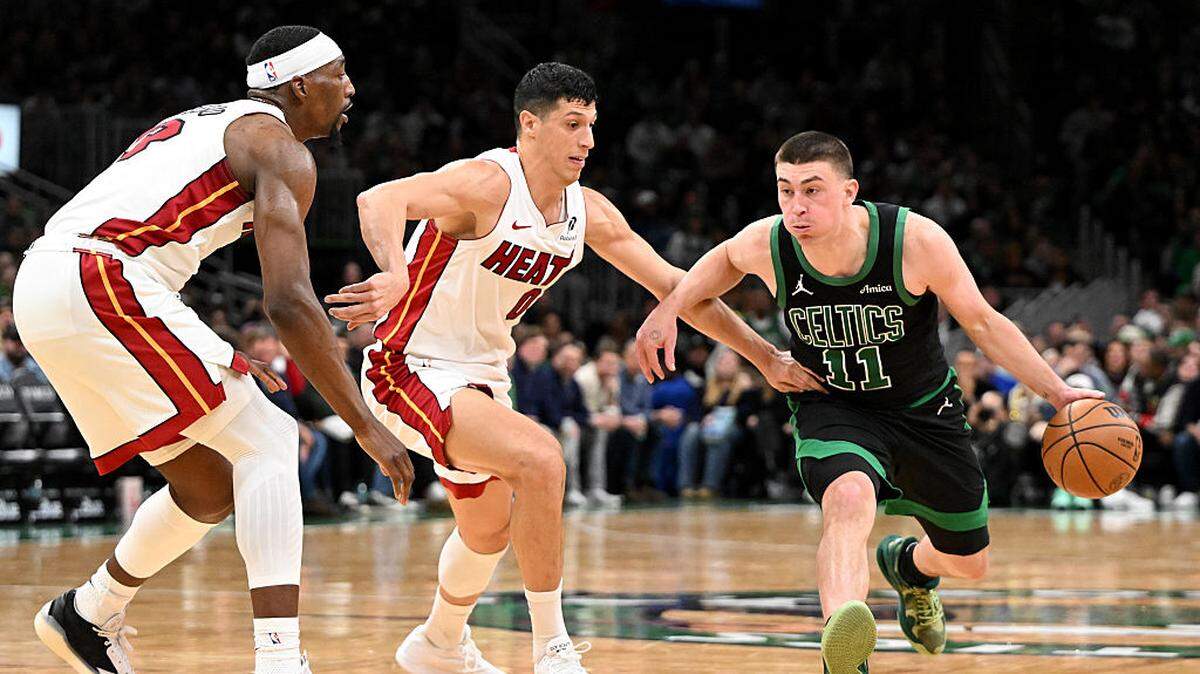 Payton Pritchard #11 of the Boston Celtics drives to the basket against the Miami Heat during the second half at the TD Garden on February 06, 2026 in Boston, Massachusetts.