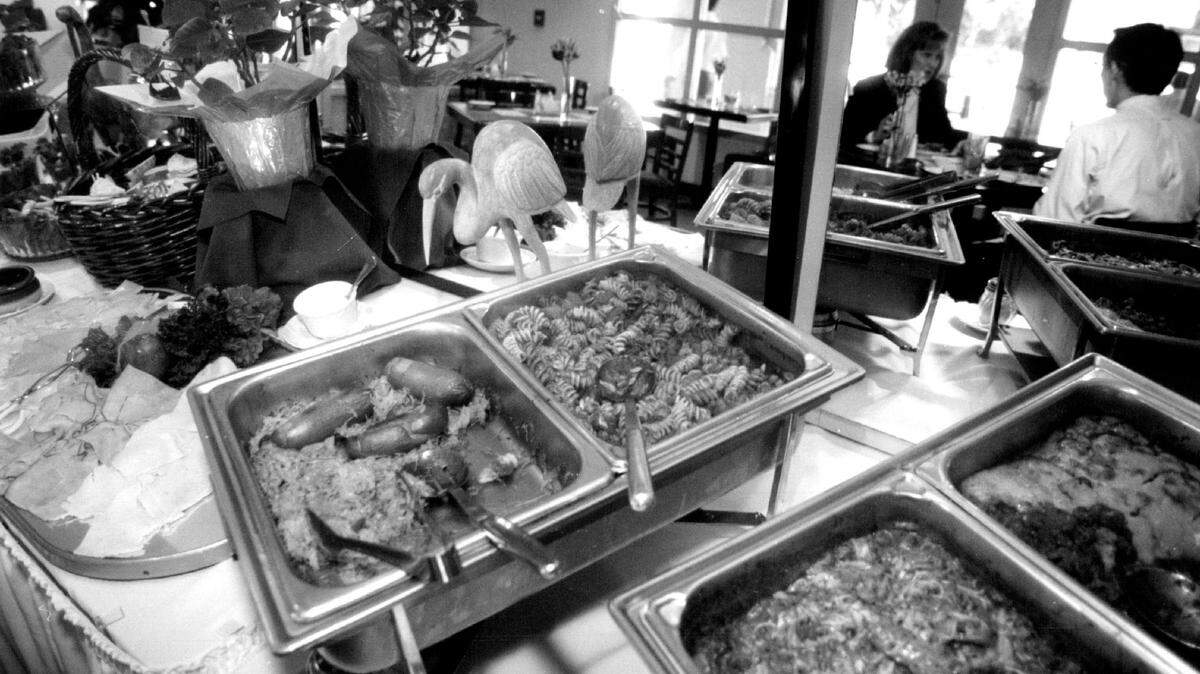 Dineres enjoy the lunch buffet at the Fountain Restaurant in Coral Gables in 1994.