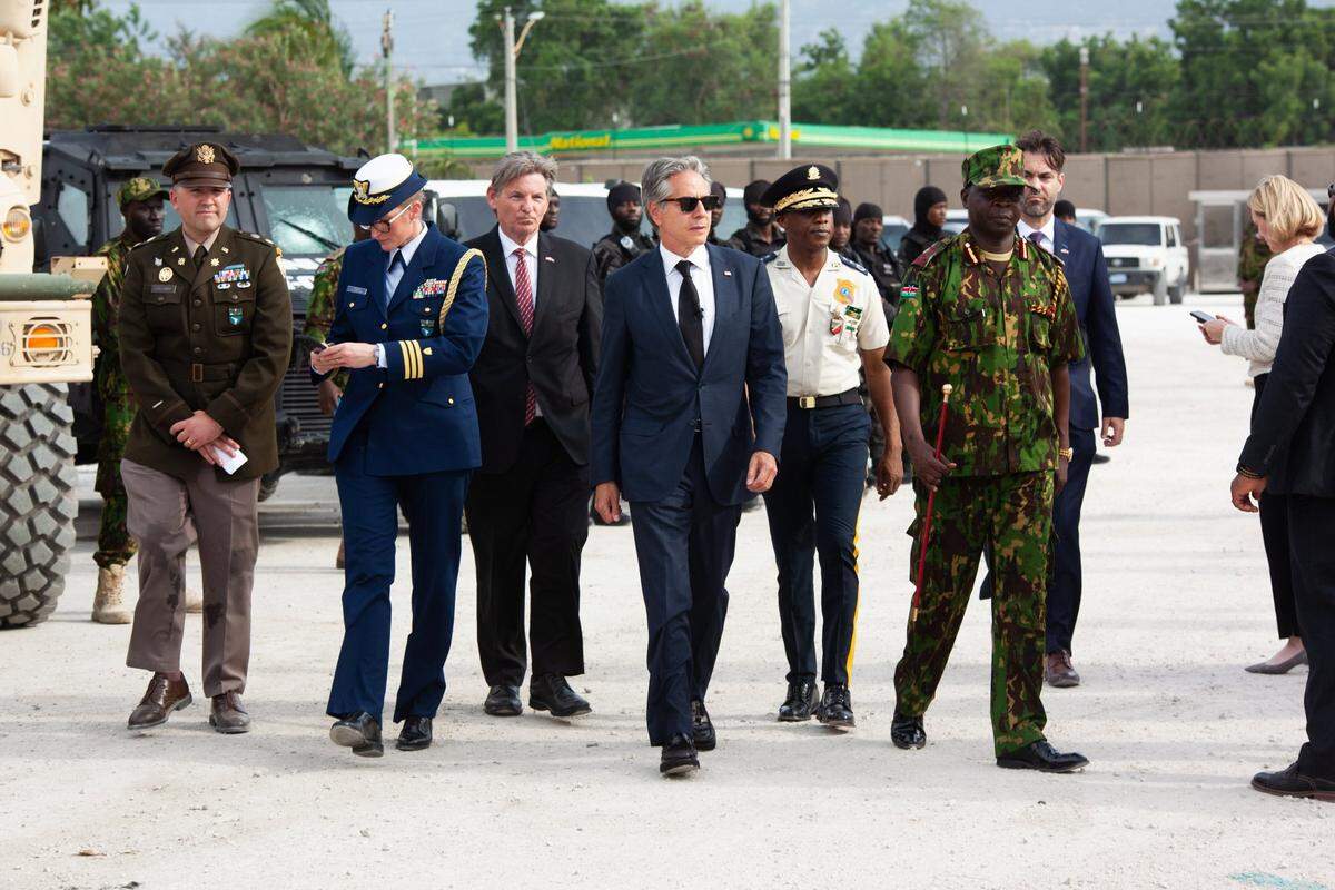 U.S. Secretary of State Antony Blinken, wearing shades, touring the Multinational Security Support mission based in Port-au-Prince, Haiti on September 5, 2024, the same day an extrajudicial killing would be carried out, according to police. Blinken is joined by Haiti Police Chief Rameau Normil, head of the MSS Force Commander Godfrey Otunge and U.S. Ambassador Dennis Hankins, among others.