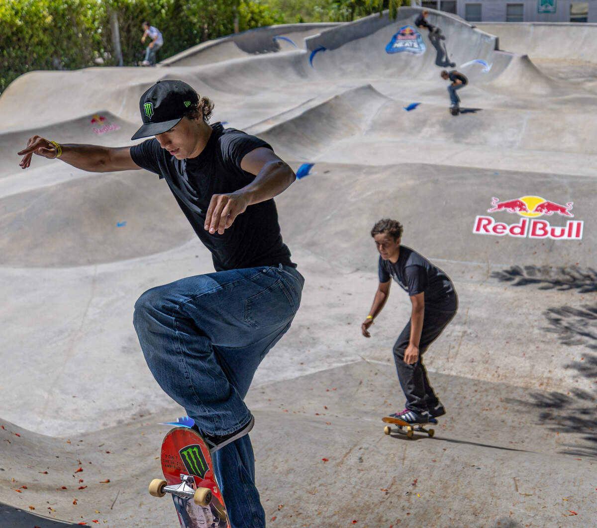 Skateboarders skate the pump track between runs during the Concrete Heats at SkateBird Miami in Miami, Fla., on Sunday, June 21, 2026, with Camden Mashore followed by Sebastian Bradrach in the foreground.