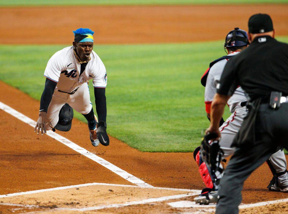 Miami Marlins second baseman Jazz Chisholm Jr. (2) scores during the first inning of a baseball game against the Washington Nationals at LoanDepot Park on Wednesday, May 18, 2022 in Miami, Florida..