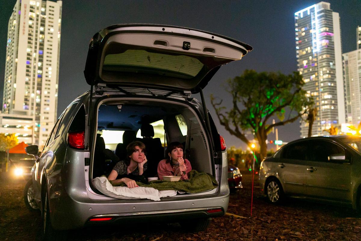 Flipp Posner, left, and Chandler Jaffe watch ‘Suspiria’ at the Nite Owl Drive-In theater in downtown Miami on Friday, January 22, 2021.