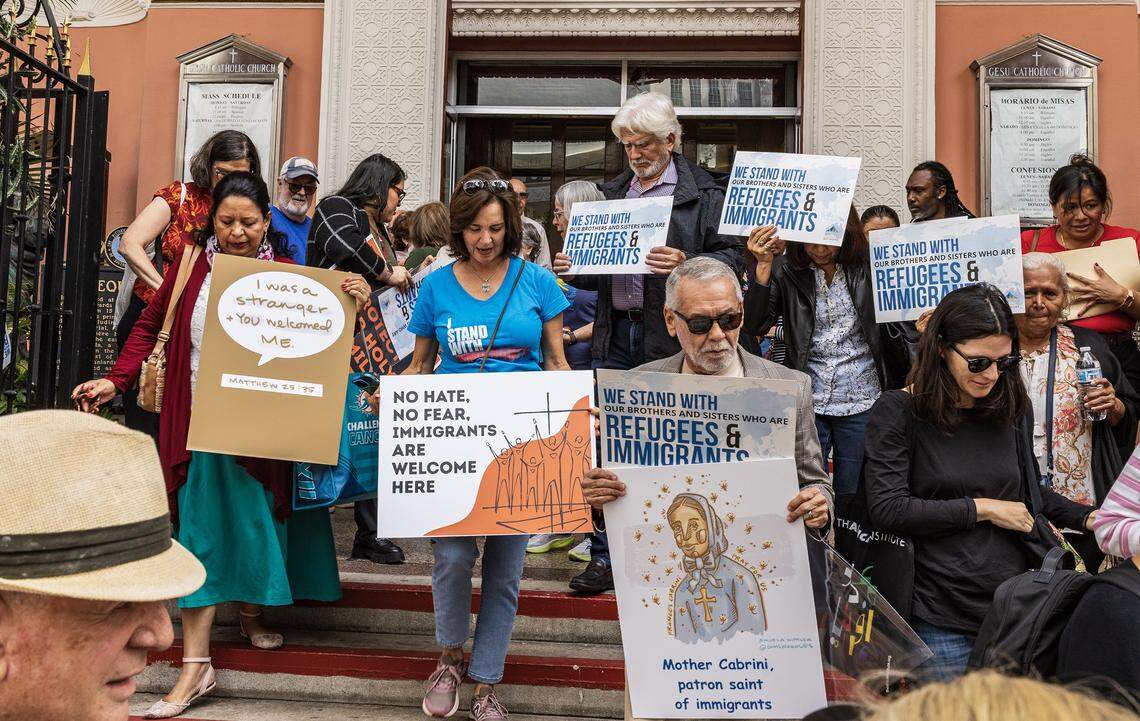 A group of immigrants advocates get ready to depart from the Gesu Catholic Church in downtown marching in a procession to the EOIR Immigration Court, as part of the nationwide “One Church, One Family: Catholic Public Witness for Immigrants” campaign, on Thursday, November 13, 2025.