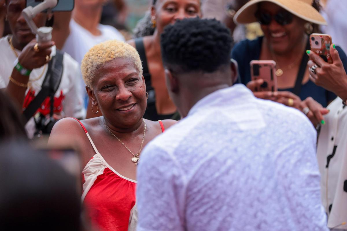 Jamaican singer Romain Virgo serenades a woman in the audience during the 19th annual Best of the Best International Music Festival at Bayfront Park in downtown Miami, Sunday, May 25, 2025.